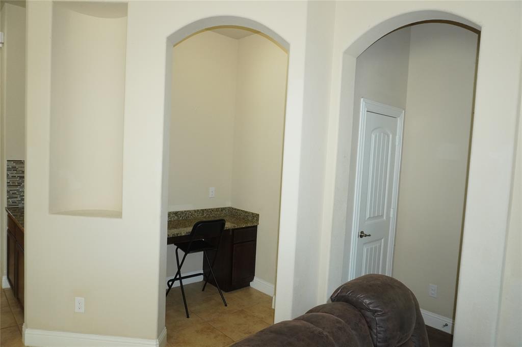 15608 Cornwallis Street Frisco, TX 75036 - Photo 15 of 23 a living room with a chair and a table