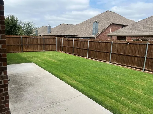 a view of a backyard with a garden