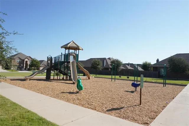 a view of a park with swings