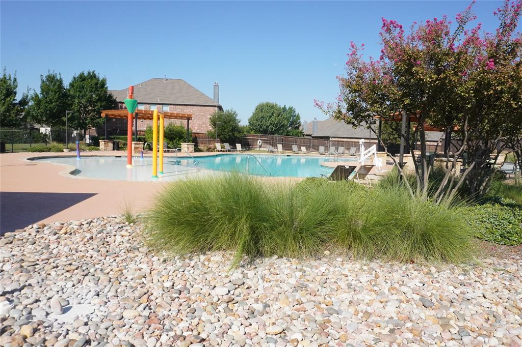 15608 Cornwallis Street Frisco, TX 75036 - Photo 22 of 23 a view of a swimming pool with a patio