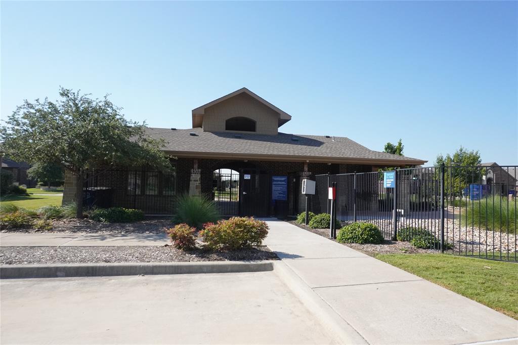 15608 Cornwallis Street Frisco, TX 75036 - Photo 23 of 23 a front view of a house with a yard and potted plants