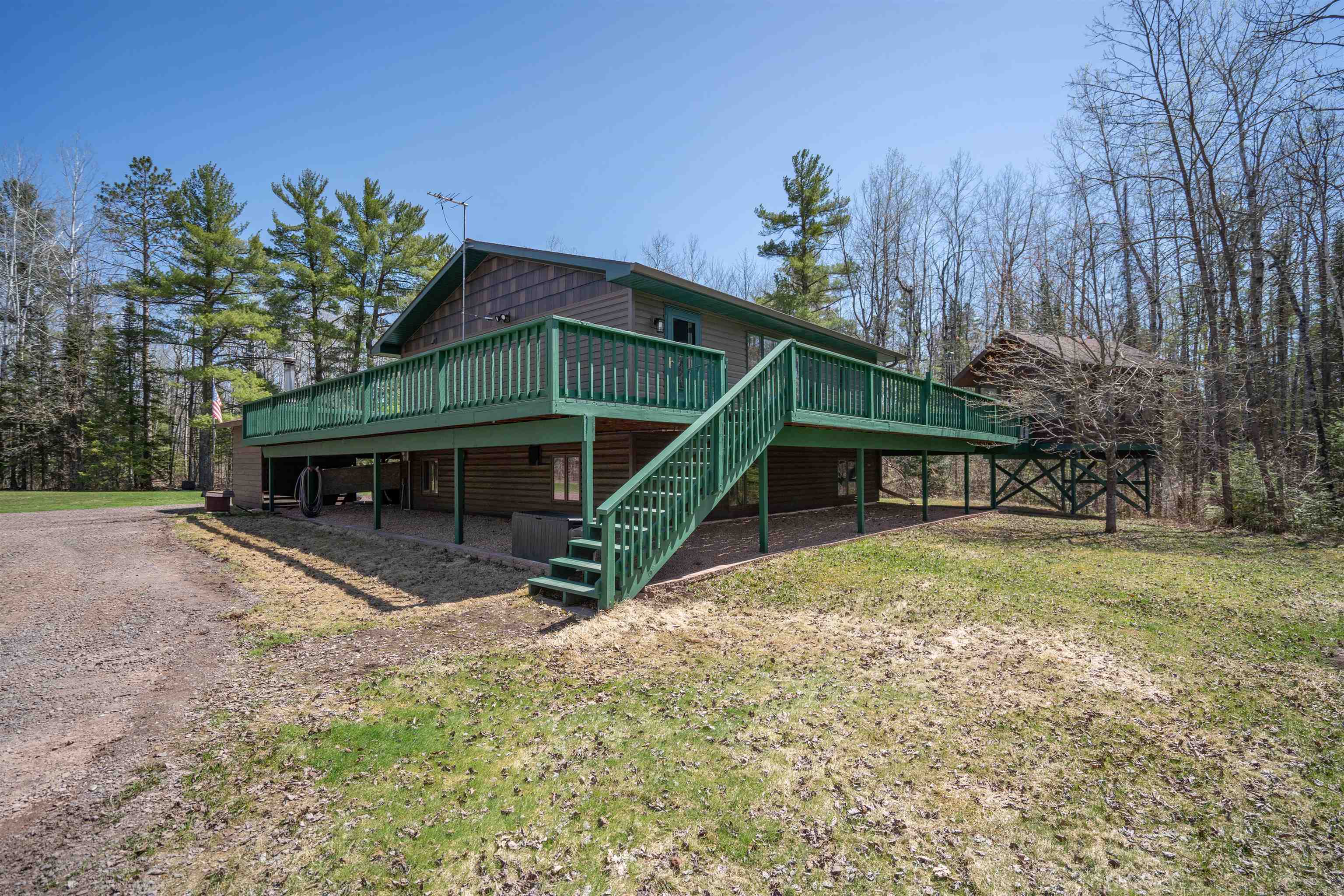6960 South County Rd B Foxboro, WI 54836 - Photo 28 of 28 Rear view of property with stairs, a deck, and log veneer siding