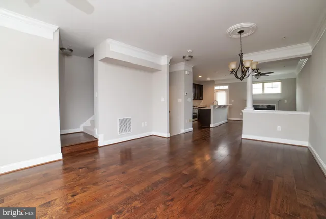 a view of a living room and wooden floor