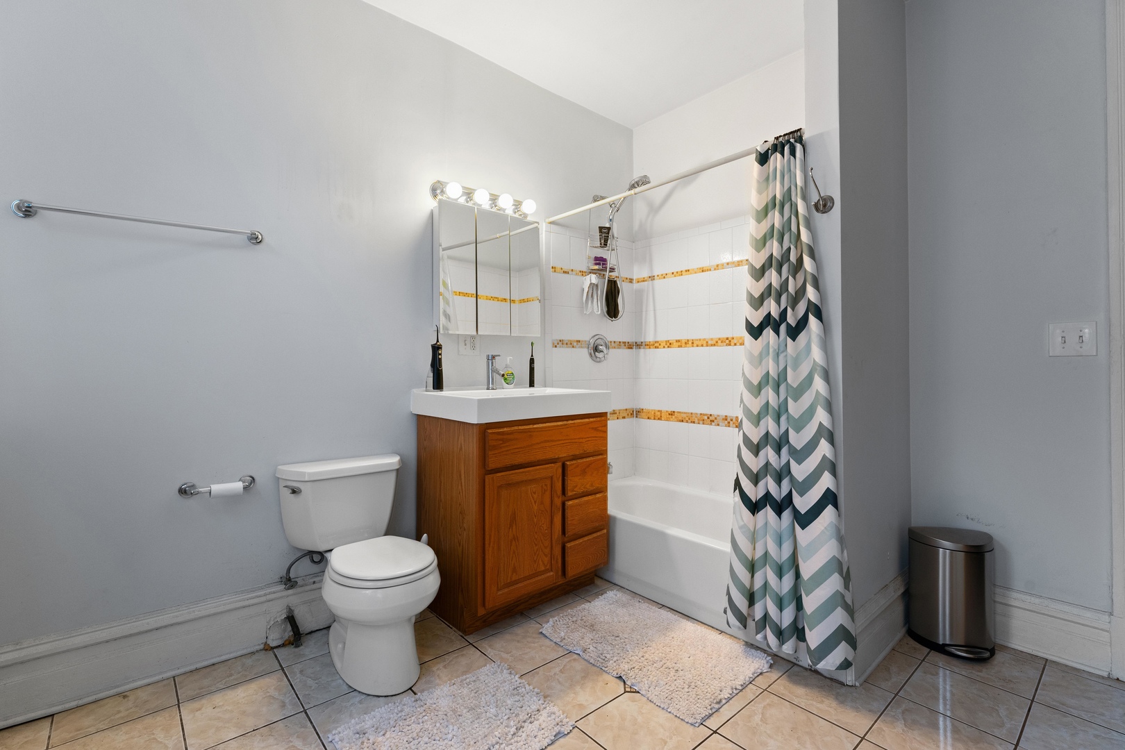 1132 East 44th Street Chicago, IL 60653 - Photo 3 of 23 a bathroom with a toilet sink and shower