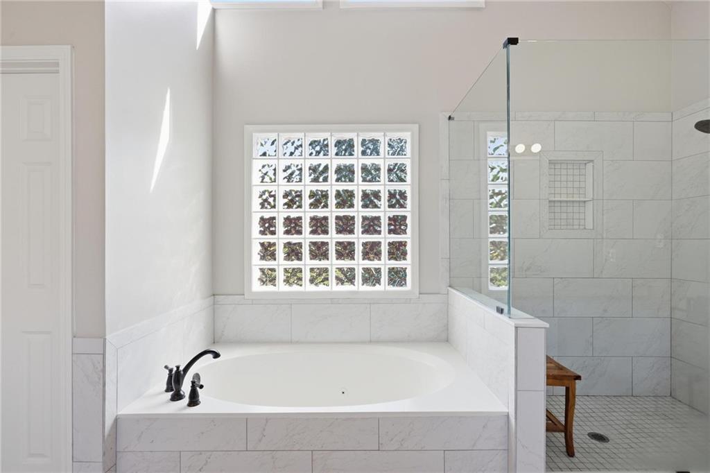 5249 Magnolia Walk Circle Atlanta, GA 30338 - Photo 15 of 30 a bathroom with a bathtub and window