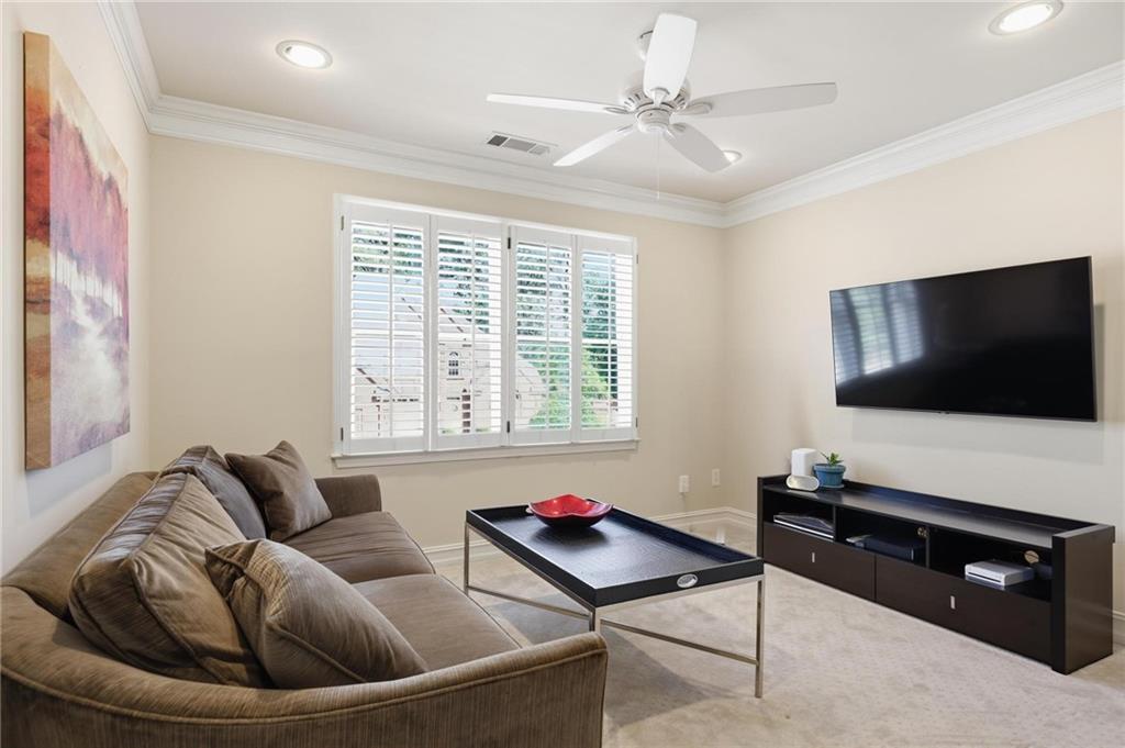 5249 Magnolia Walk Circle Atlanta, GA 30338 - Photo 19 of 30 a living room with furniture and a flat screen tv