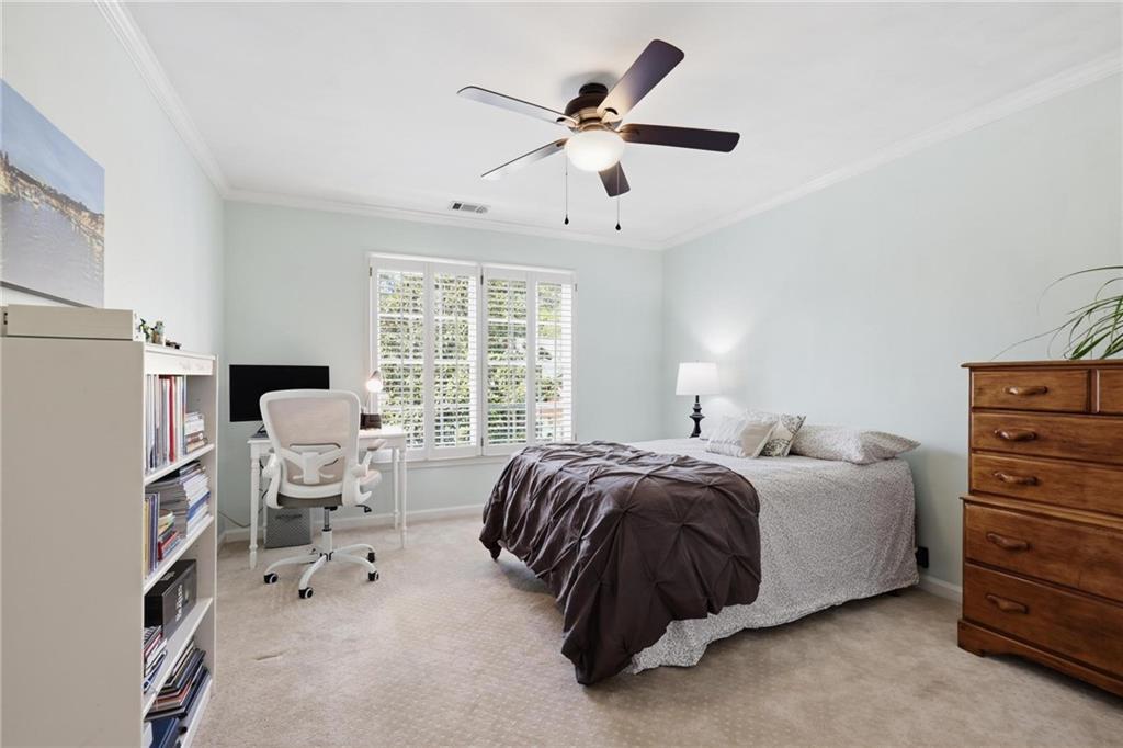 5249 Magnolia Walk Circle Atlanta, GA 30338 - Photo 21 of 30 a spacious bedroom with a bed and a window