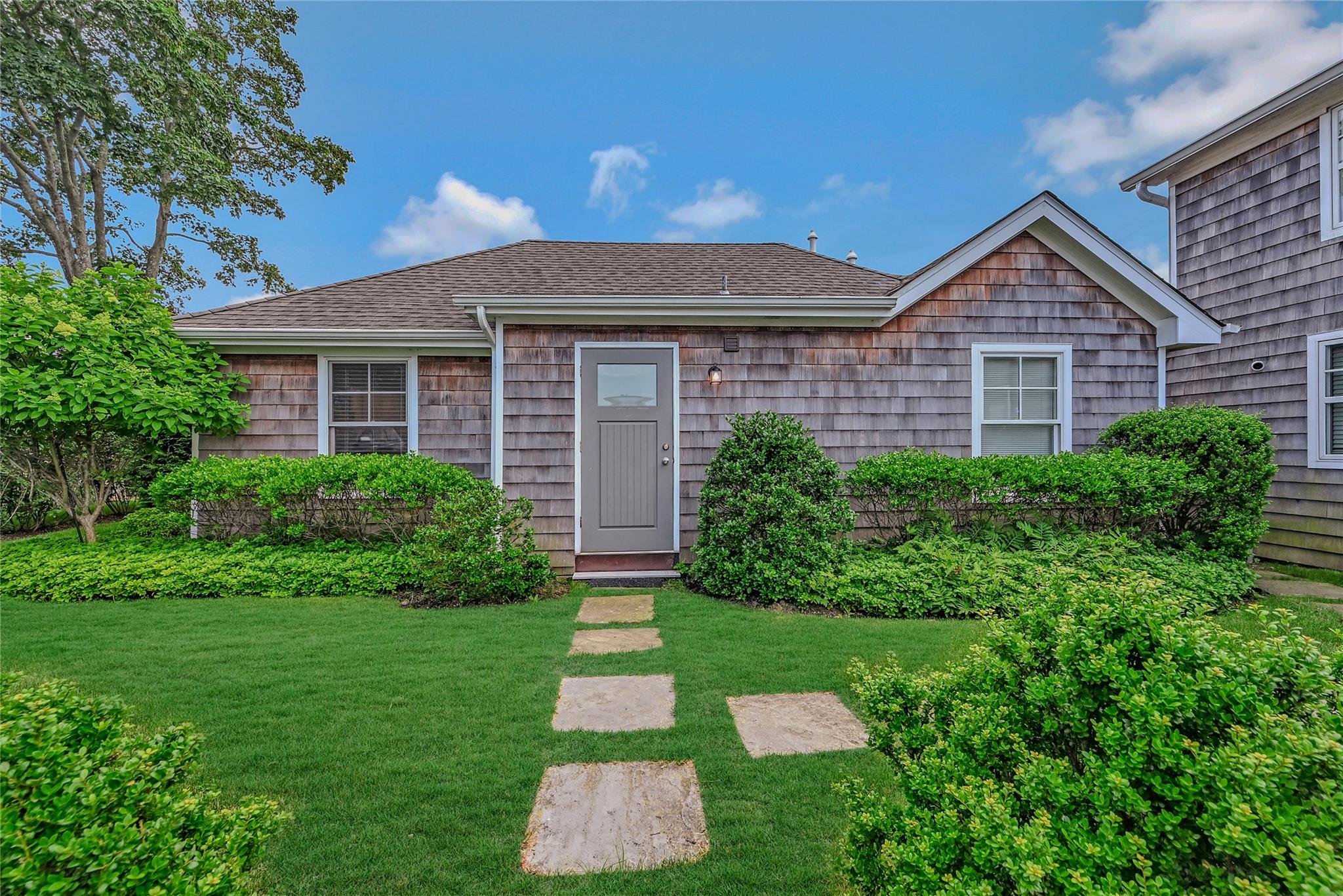 14 Mitchell Road Westhampton Beach, NY 11978 - Photo 1 of 1 Single story home with a front yard and a shingled roof
