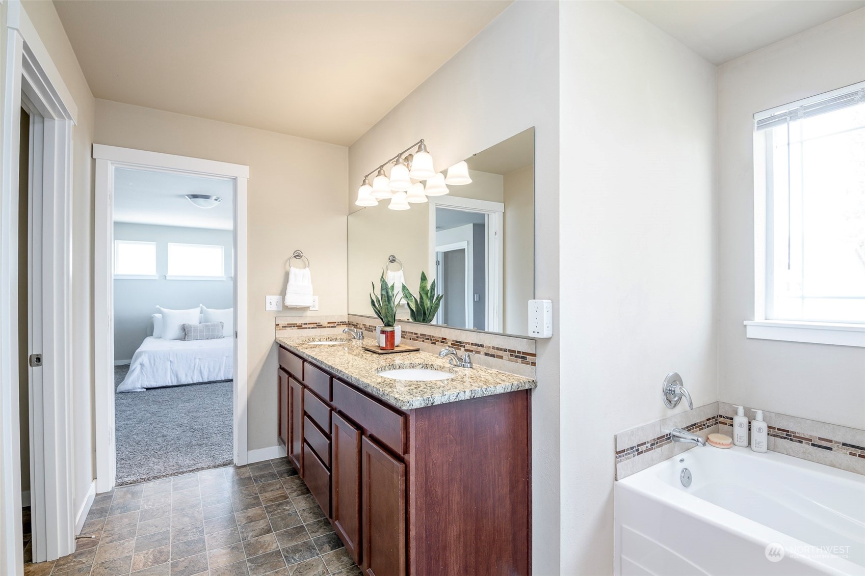 14453 98th Way Southeast Yelm, WA 98597 - Photo 14 of 23 a en suite bathroom with a granite countertop sink and a mirror
