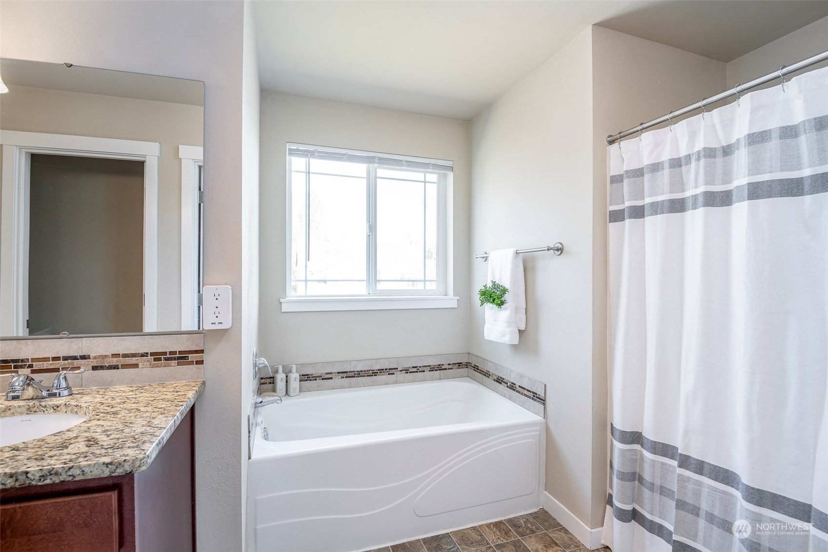 14453 98th Way Southeast Yelm, WA 98597 - Photo 15 of 23 a bathroom with a granite countertop bathtub and a sink