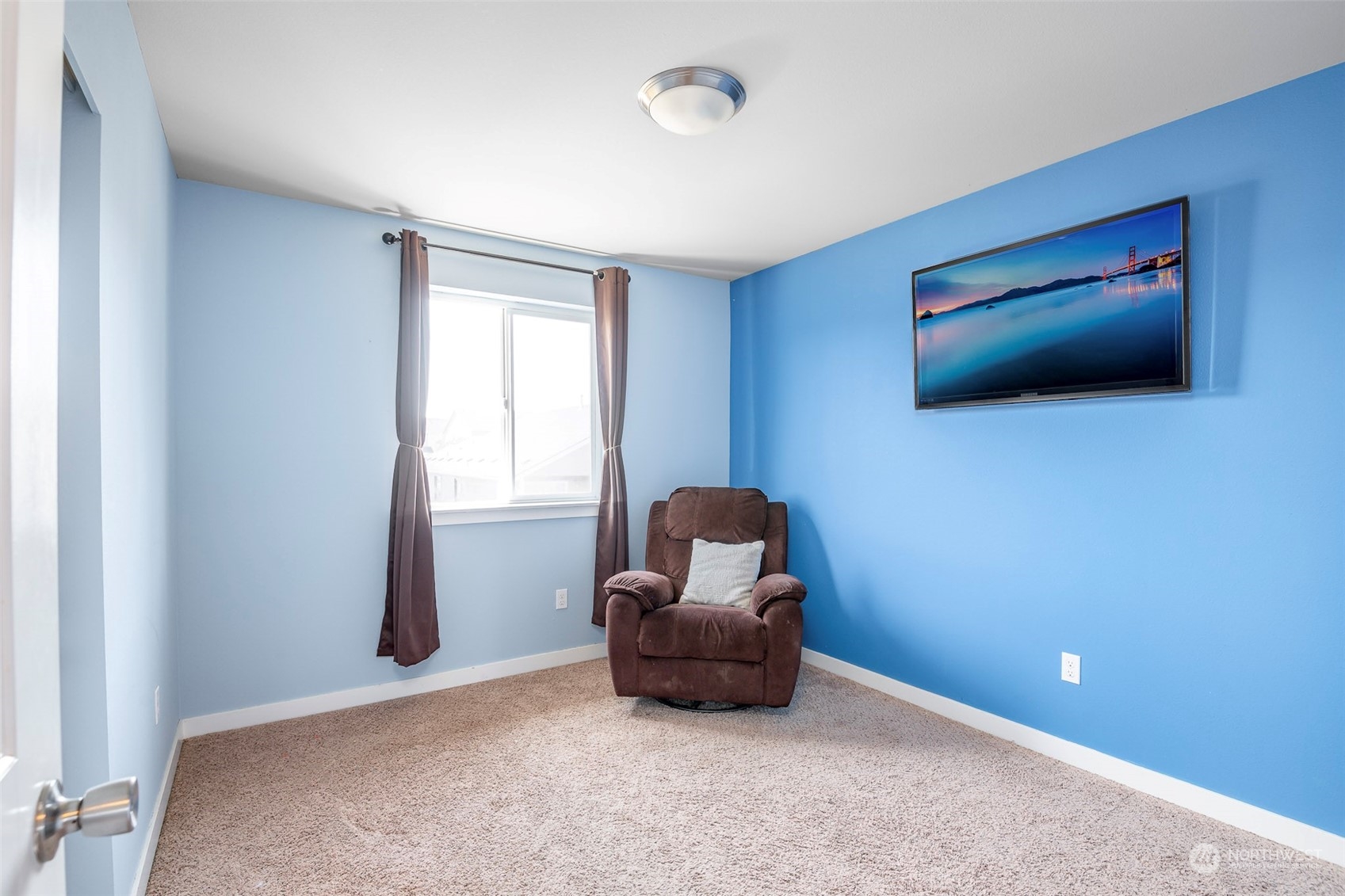 14453 98th Way Southeast Yelm, WA 98597 - Photo 16 of 23 a living room with furniture and a flat screen tv
