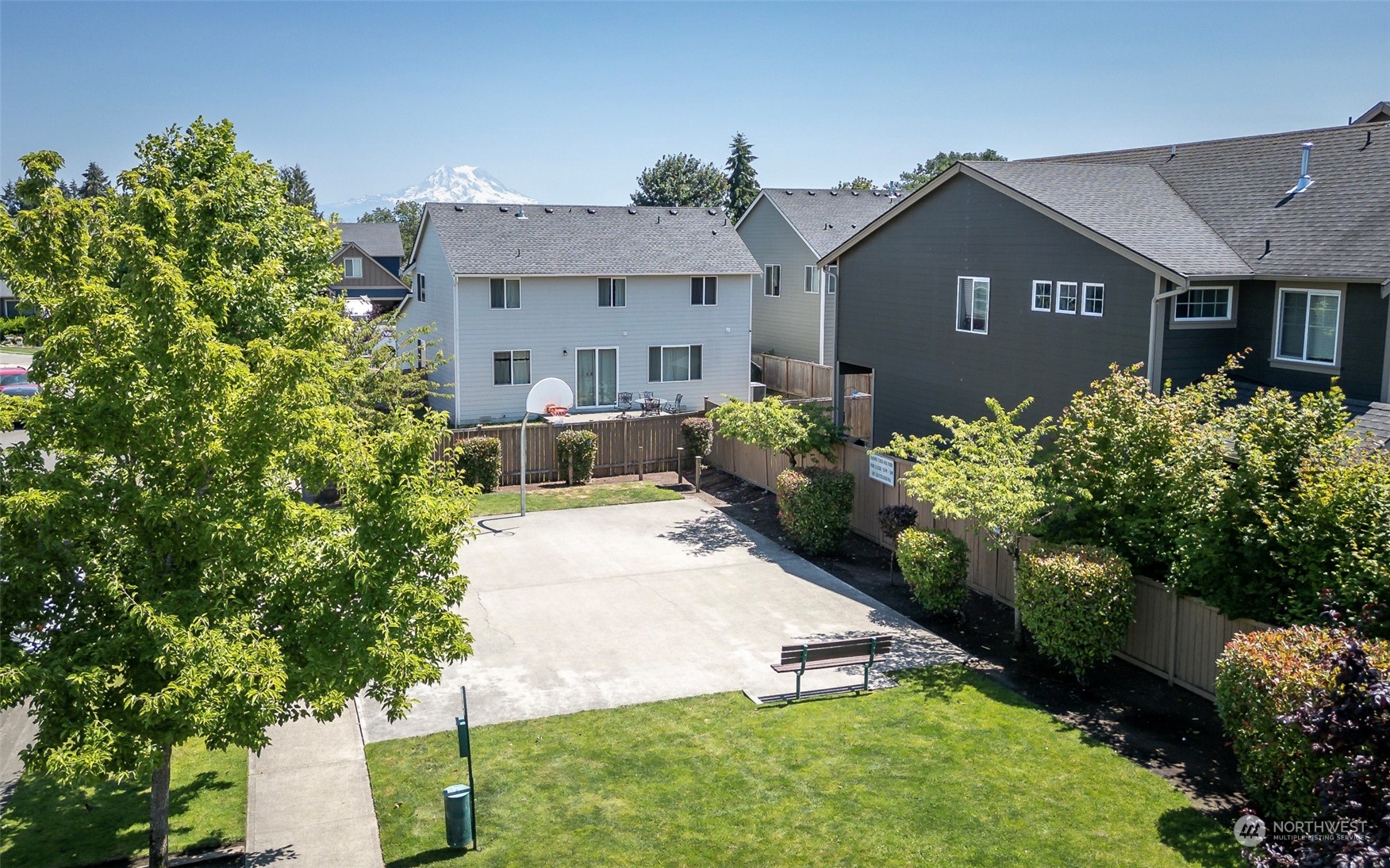 14453 98th Way Southeast Yelm, WA 98597 - Photo 22 of 23 a front view of a house with a yard and a garden