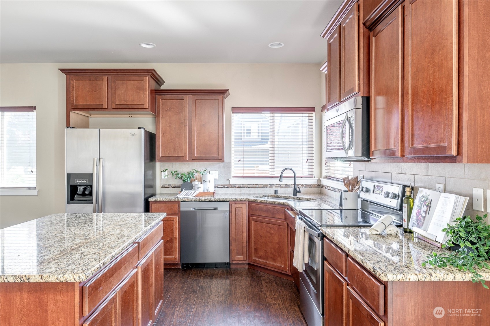 14453 98th Way Southeast Yelm, WA 98597 - Photo 7 of 23 a kitchen with stainless steel appliances granite countertop a sink stove and refrigerator