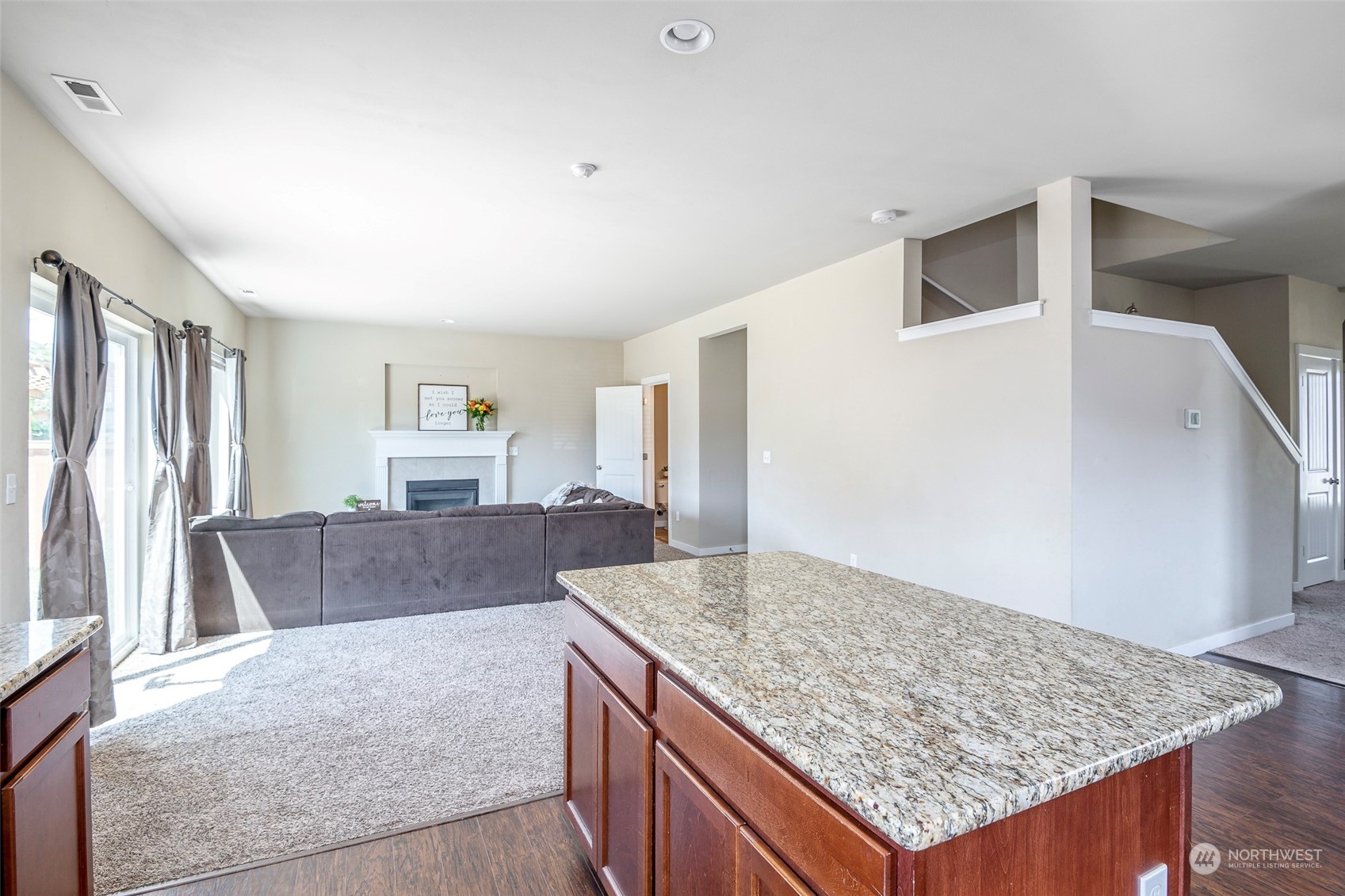 14453 98th Way Southeast Yelm, WA 98597 - Photo 8 of 23 a living room with granite countertop furniture and fireplace