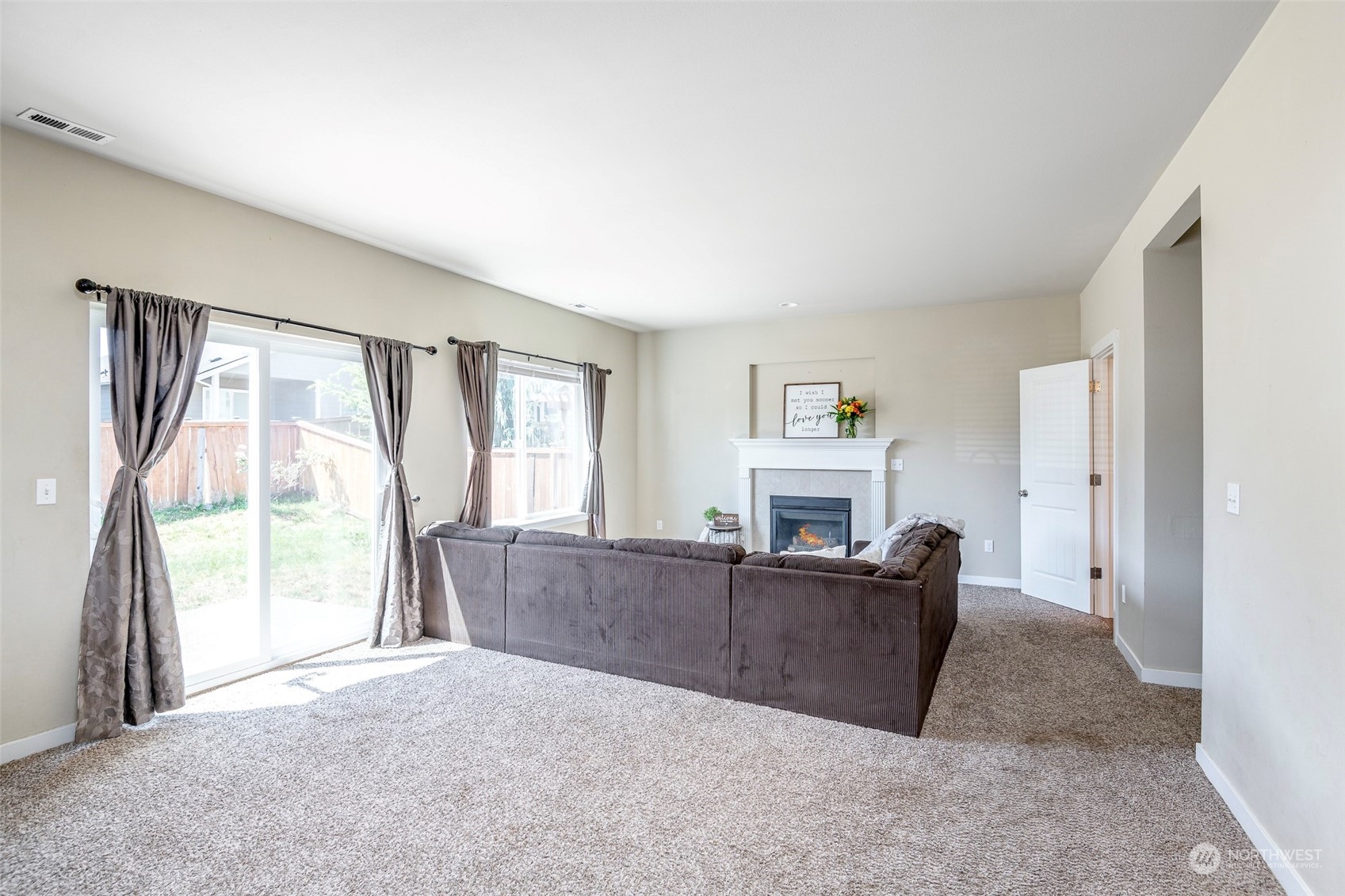 14453 98th Way Southeast Yelm, WA 98597 - Photo 9 of 23 a living room with furniture and a large window