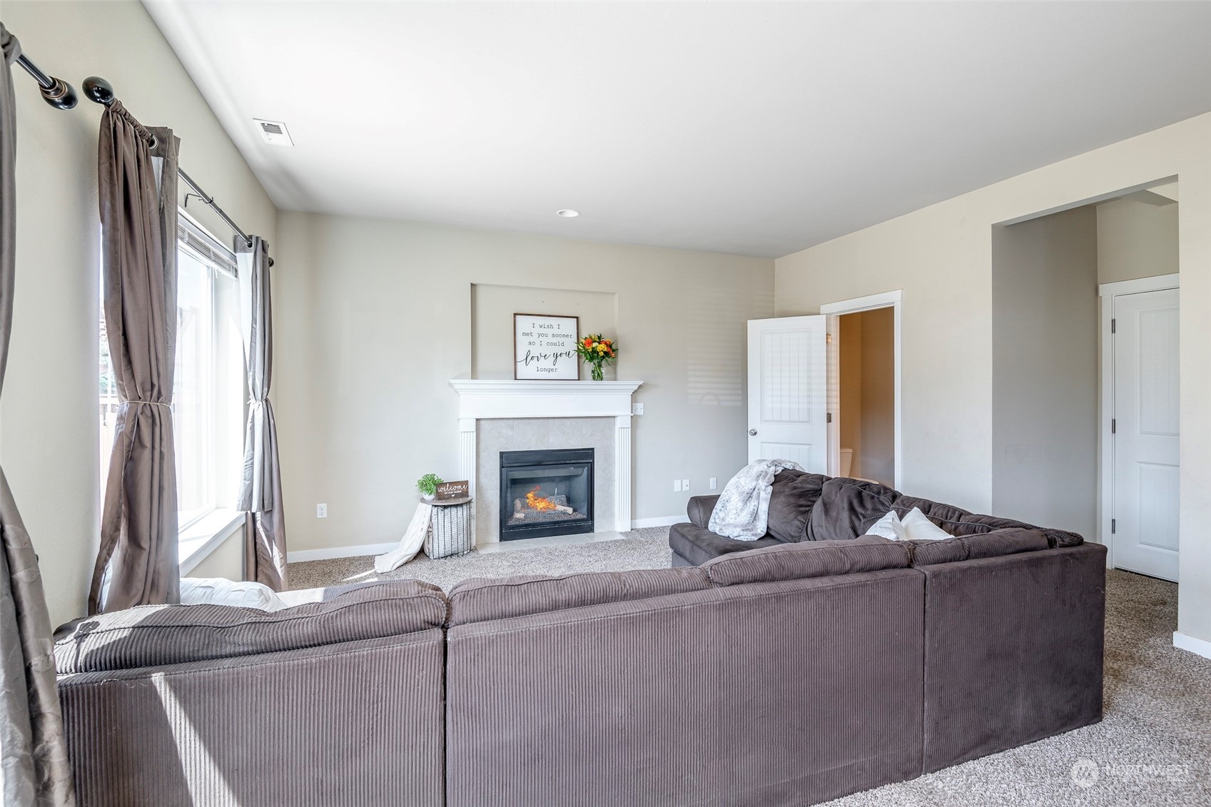 14453 98th Way Southeast Yelm, WA 98597 - Photo 10 of 23 a living room with furniture and a fireplace