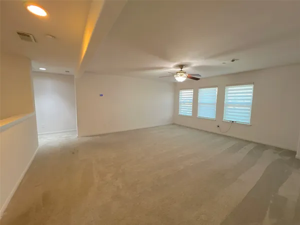 a view of an empty room with a window