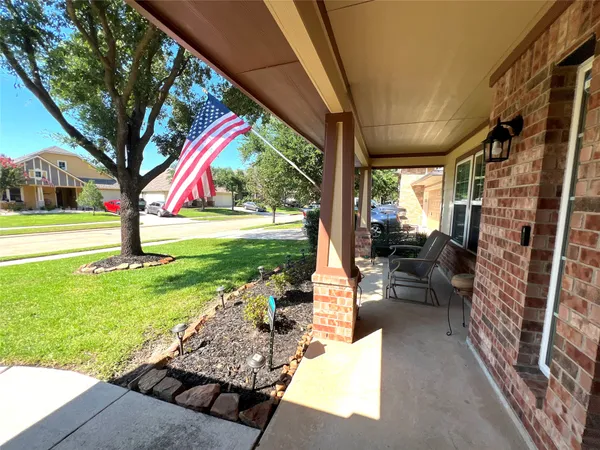 a house view with a sitting space and garden view