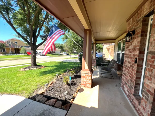 a house view with a sitting space and garden view