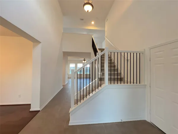 a view of staircase with rug