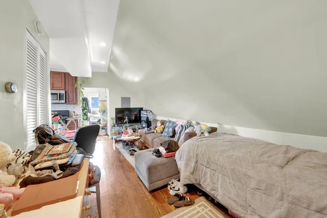 a bed room with two bed and a couch