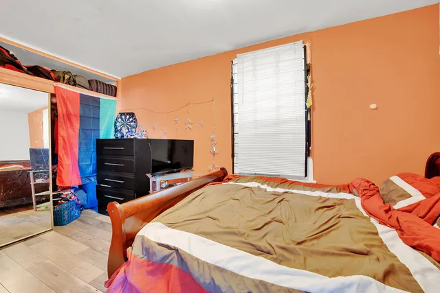 a bedroom with a bed and television