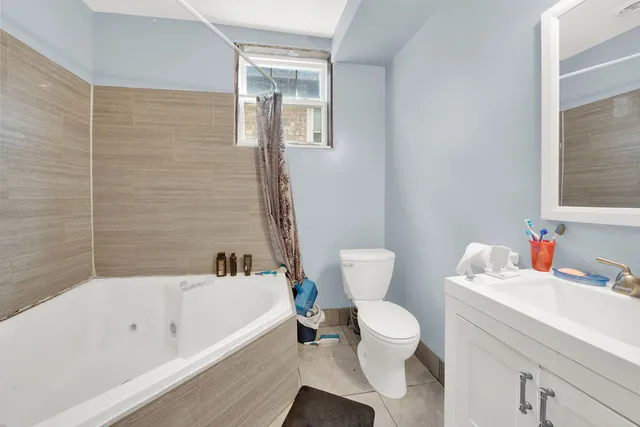 a bathroom with a sink a toilet and a bathtub