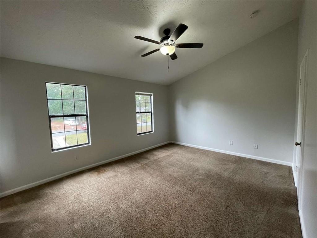 1088 Riva Ridge Drive Northwest Norcross, GA 30093 - Photo 15 of 43 an empty room with windows and fan