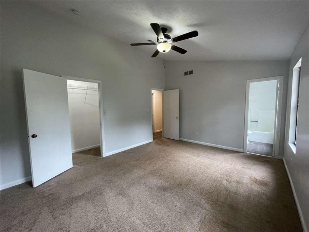 1088 Riva Ridge Drive Northwest Norcross, GA 30093 - Photo 16 of 43 a view of a livingroom with a ceiling fan and window