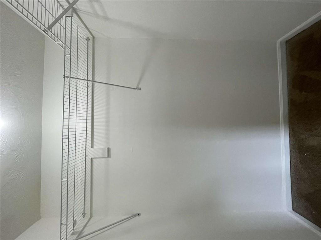 1088 Riva Ridge Drive Northwest Norcross, GA 30093 - Photo 17 of 43 a view of a room with racks on the wall