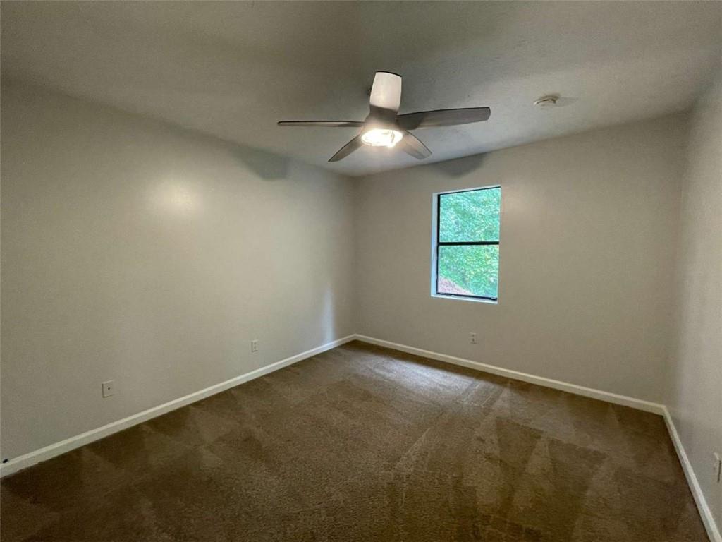 1088 Riva Ridge Drive Northwest Norcross, GA 30093 - Photo 19 of 43 an empty room with a window
