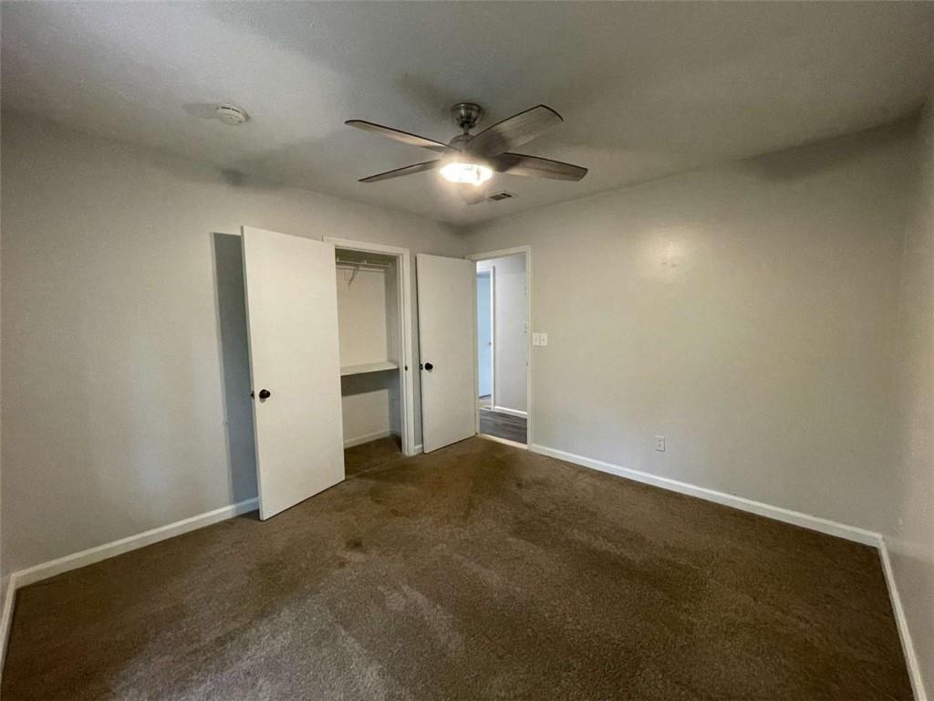 1088 Riva Ridge Drive Northwest Norcross, GA 30093 - Photo 20 of 43 an empty room with closet and fan