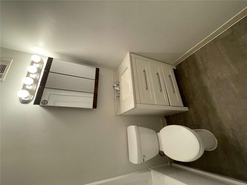 1088 Riva Ridge Drive Northwest Norcross, GA 30093 - Photo 21 of 43 a bathroom with a toilet a sink and mirror