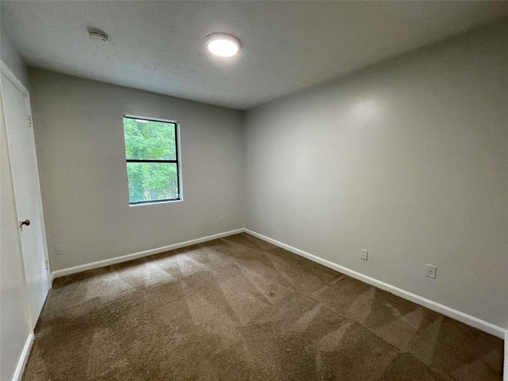 1088 Riva Ridge Drive Northwest Norcross, GA 30093 - Photo 23 of 43 an empty room with a window