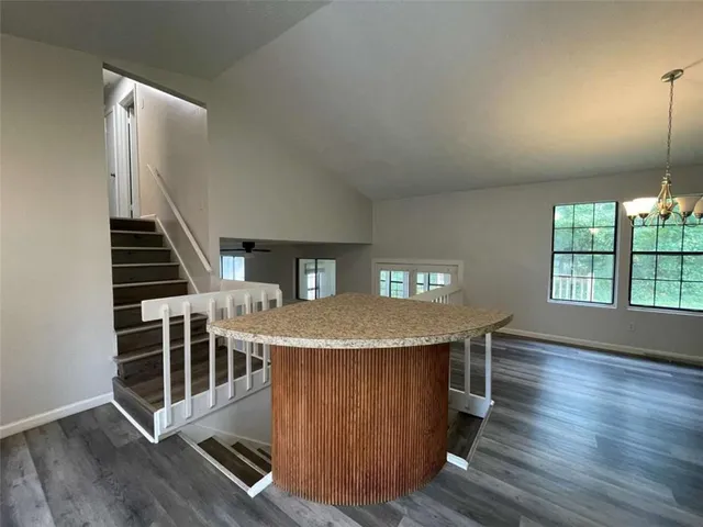 a dinning room with a table and chairs