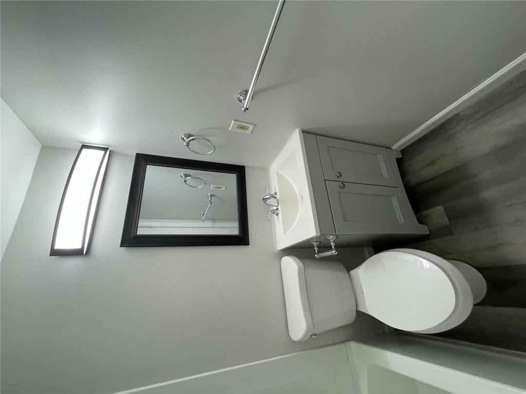 1088 Riva Ridge Drive Northwest Norcross, GA 30093 - Photo 32 of 43 a bathroom with a toilet sink and mirror