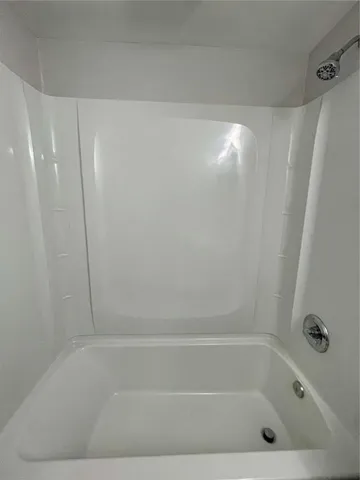 a bathroom with a bath tub