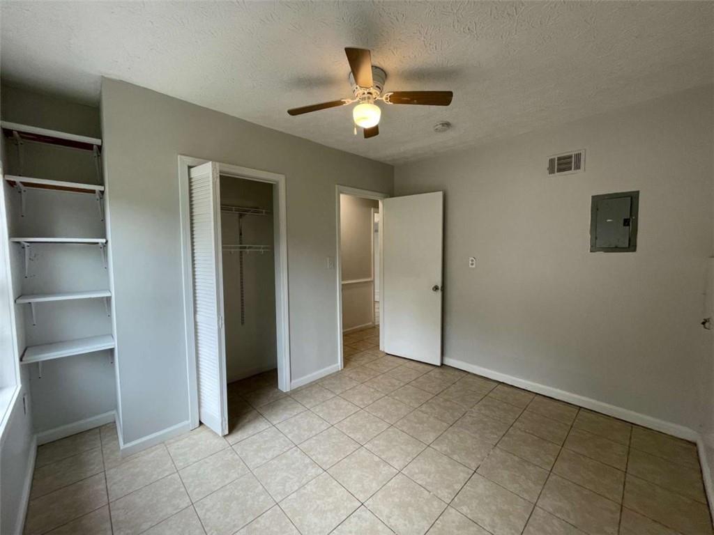 1088 Riva Ridge Drive Northwest Norcross, GA 30093 - Photo 35 of 43 a view of an empty room with a chandelier fan