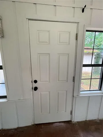 a view of house with backyard and deck