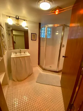 a bathroom with a sink and mirror
