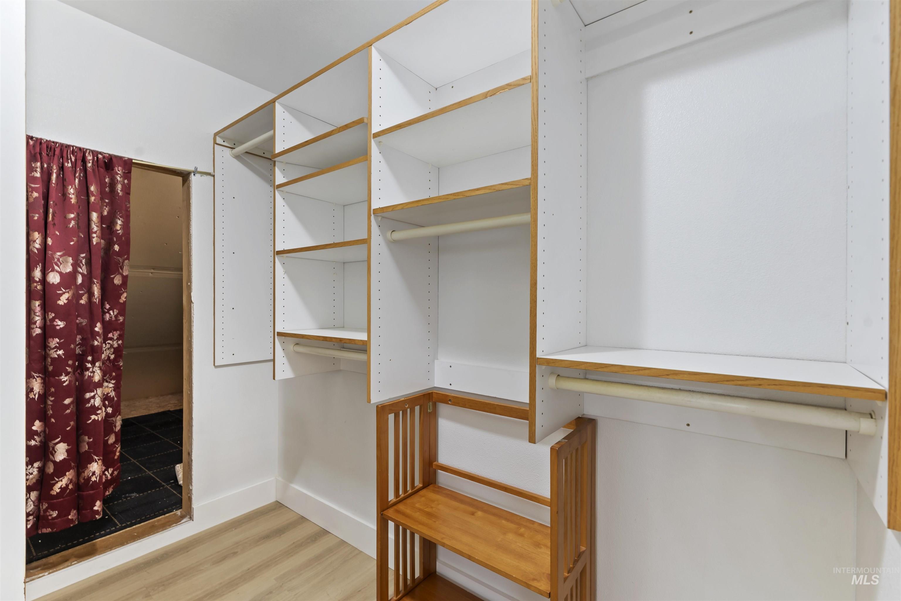 3160 East Springwood Drive Meridian, ID 83642 - Photo 28 of 41 Walk in closet with light wood-style floors