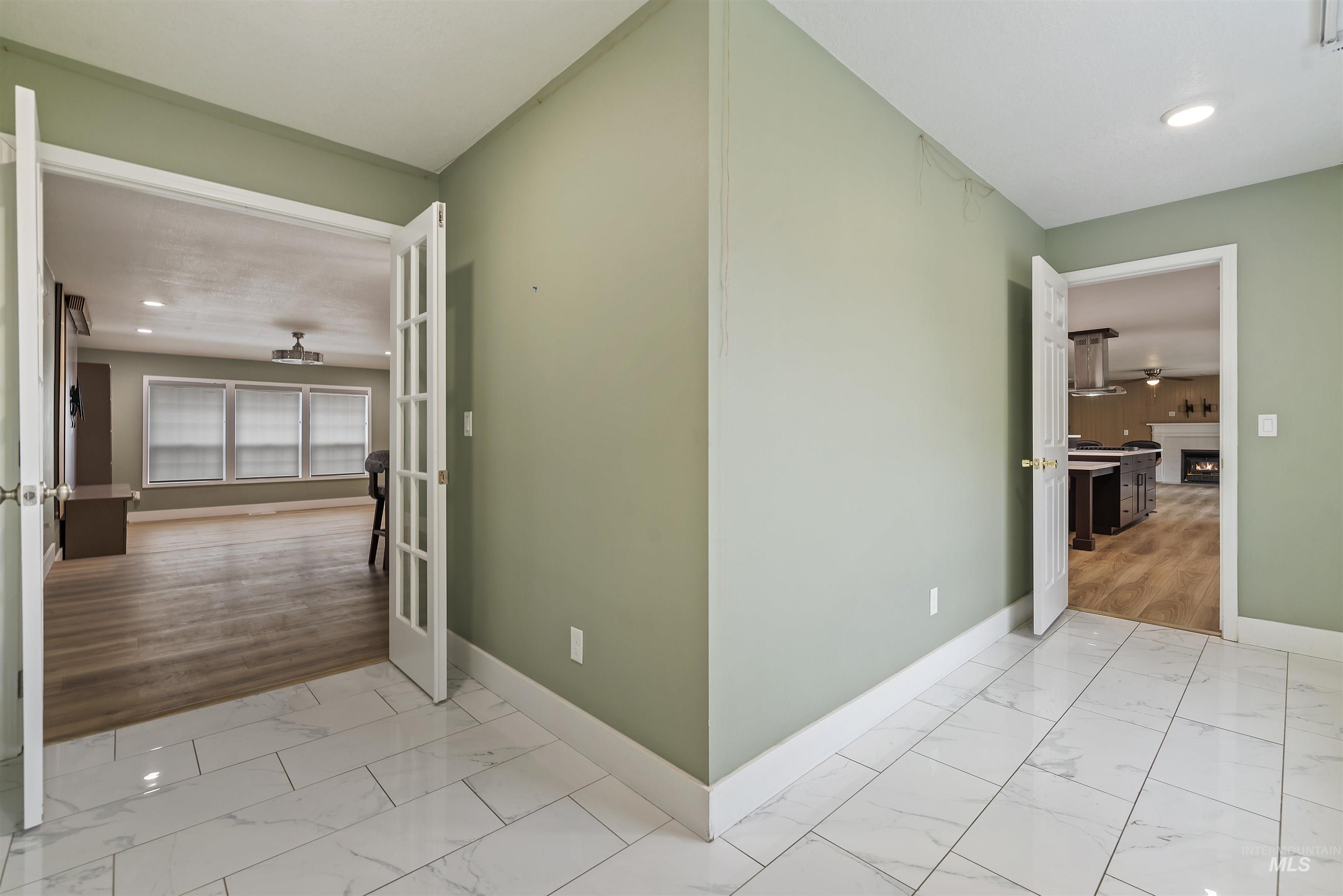 3160 East Springwood Drive Meridian, ID 83642 - Photo 32 of 41 Hall with recessed lighting and light marble finish floors