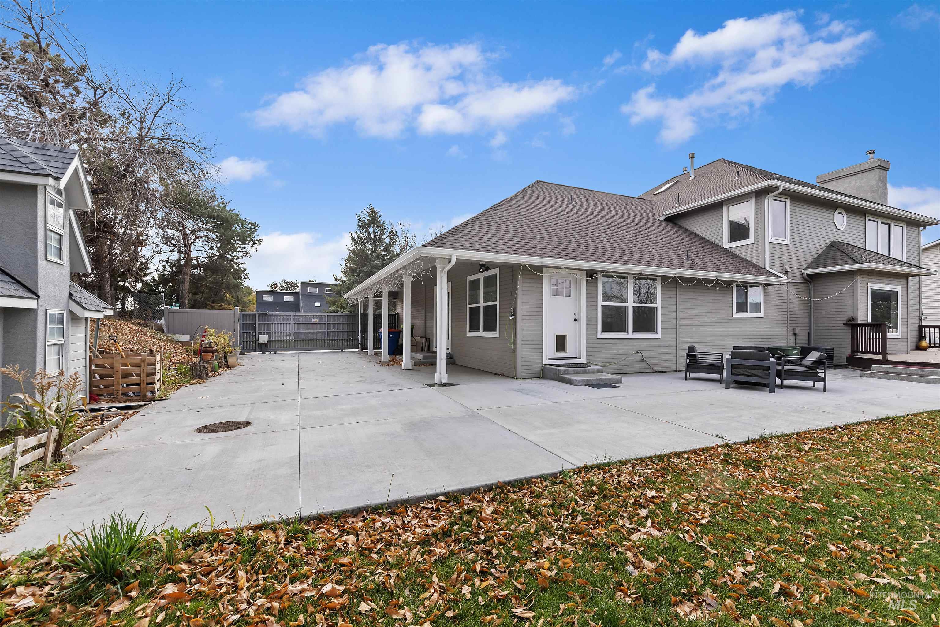 3160 East Springwood Drive Meridian, ID 83642 - Photo 37 of 41 Back of house featuring a patio, an outdoor hangout area, a chimney, and roof with shingles