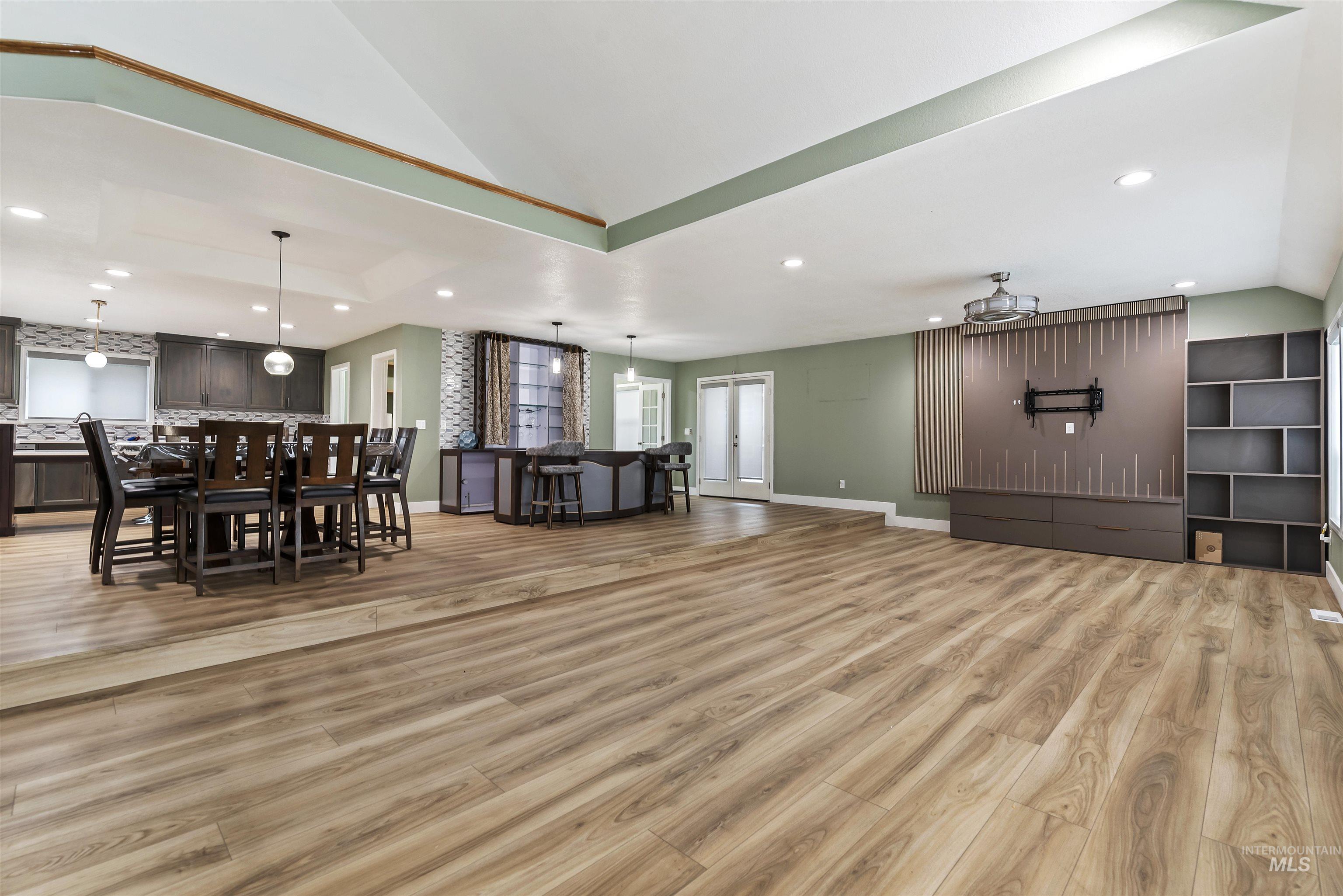 3160 East Springwood Drive Meridian, ID 83642 - Photo 10 of 41 Living room with recessed lighting, lofted ceiling, and light wood finished floors