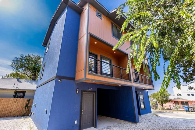 a view of a building with a tree