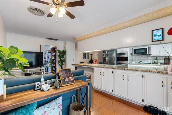 a kitchen with stainless steel appliances granite countertop a sink and cabinets