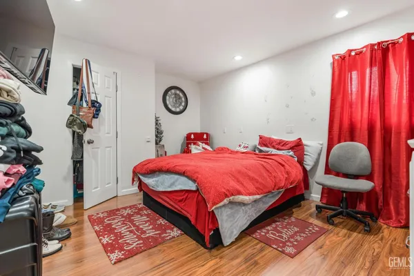 a bed room with a bed and a chair