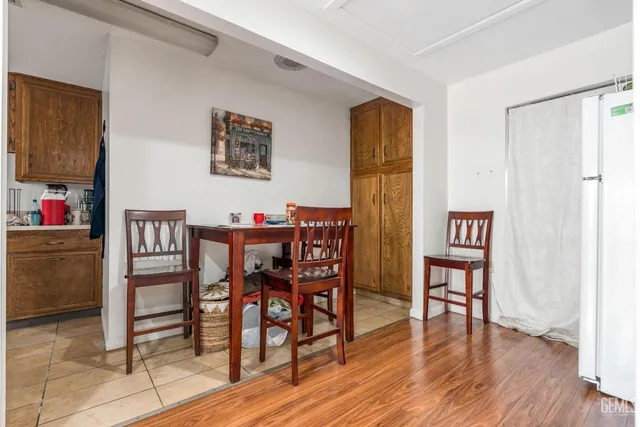 a dining room with furniture and wooden floor