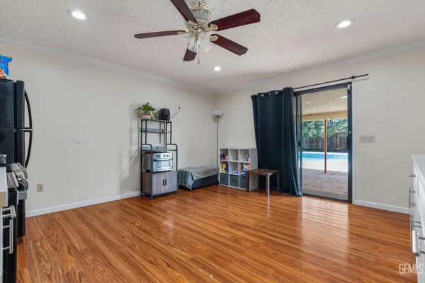 a room with wooden floor and furniture