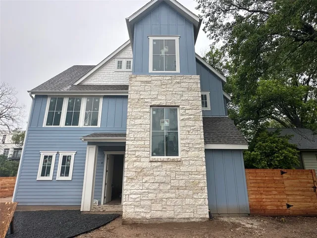a front view of a house with garage